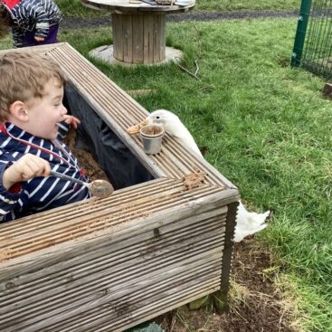 Antony School children outdoor sand pit with duck