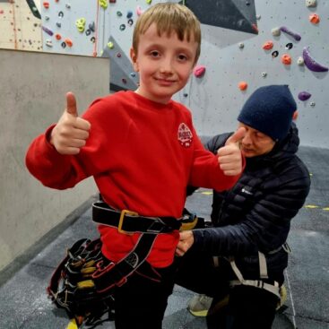 Braddock Primary Pupil getting ready to climb
