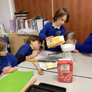 Lerryn Primary School Pupils weighing ingredients