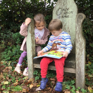 Quethiock Primary School Pupils reading outdoors Quethiock Primary School Pupils reading outdoors