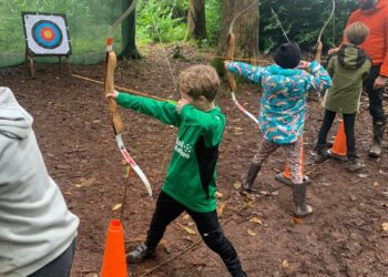 Quethiock Primary School Pupils trying archery