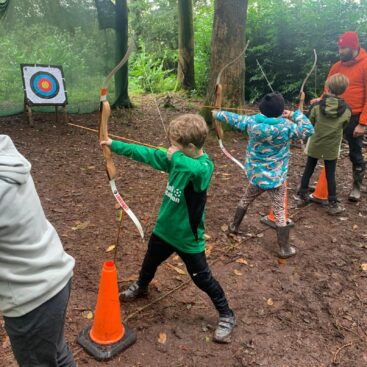 Quethiock Primary School Pupils trying archery