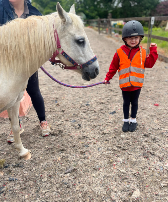 St Dominic Primary Pupil leading pony