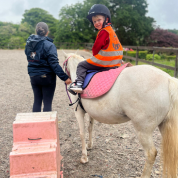 St Dominic Primary Pupil riding pony