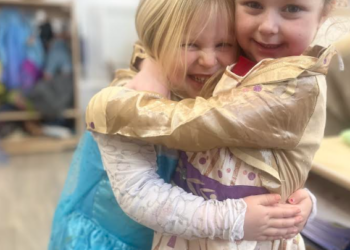 St Dominic Primary Pupils dress up hug