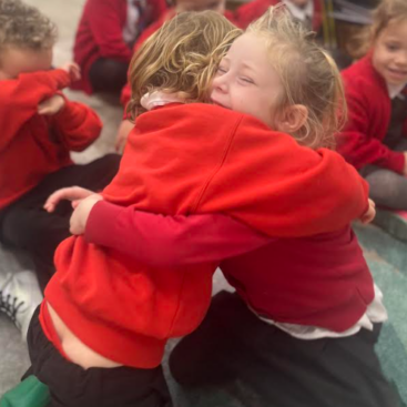 St Dominic Primary Pupils share cuddle