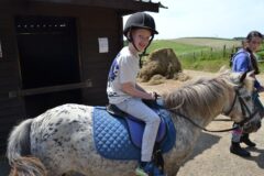 St Mellion Primary Pupil riding a pony St Mellion Primary Pupil riding a pony