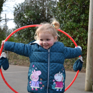 St Mellion Primary Pupil with hoop