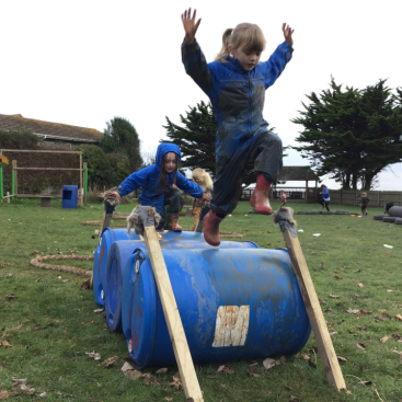 St Nicolas Primary School Pupils using outdoor obstacle course