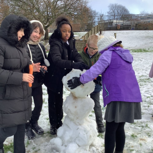 St Petrocs Primary School Pupils building snowman