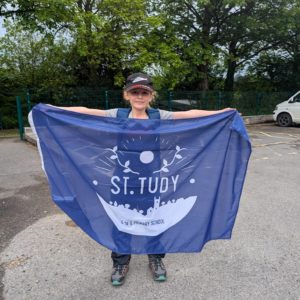 St Tudy Primary School Pupil displaying school flag