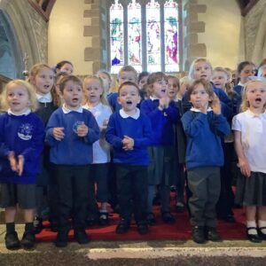 St Tudy Primary School Pupils singing in church