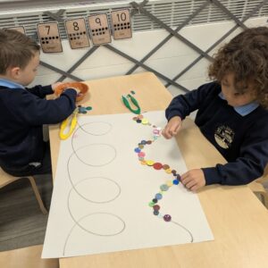 St Winnow Primary School Pupils practising patterns with buttons