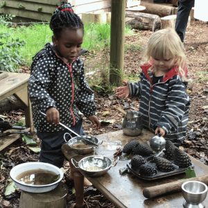 Wild Warrios Nursery Children outdoors in mud kitchen Wild Warrios Nursery Children outdoors in mud kitchen