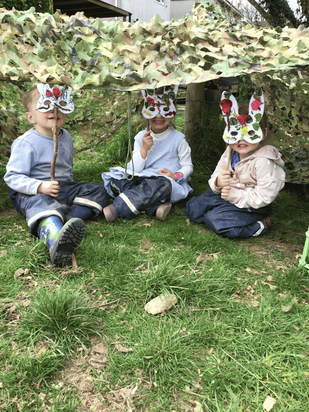 Wild Warrios Nursery Children playing in a den outdoors