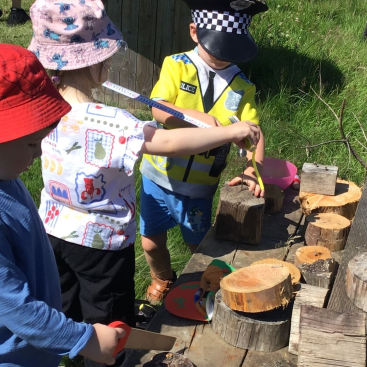 Acorns Nursery Children playing outdoors