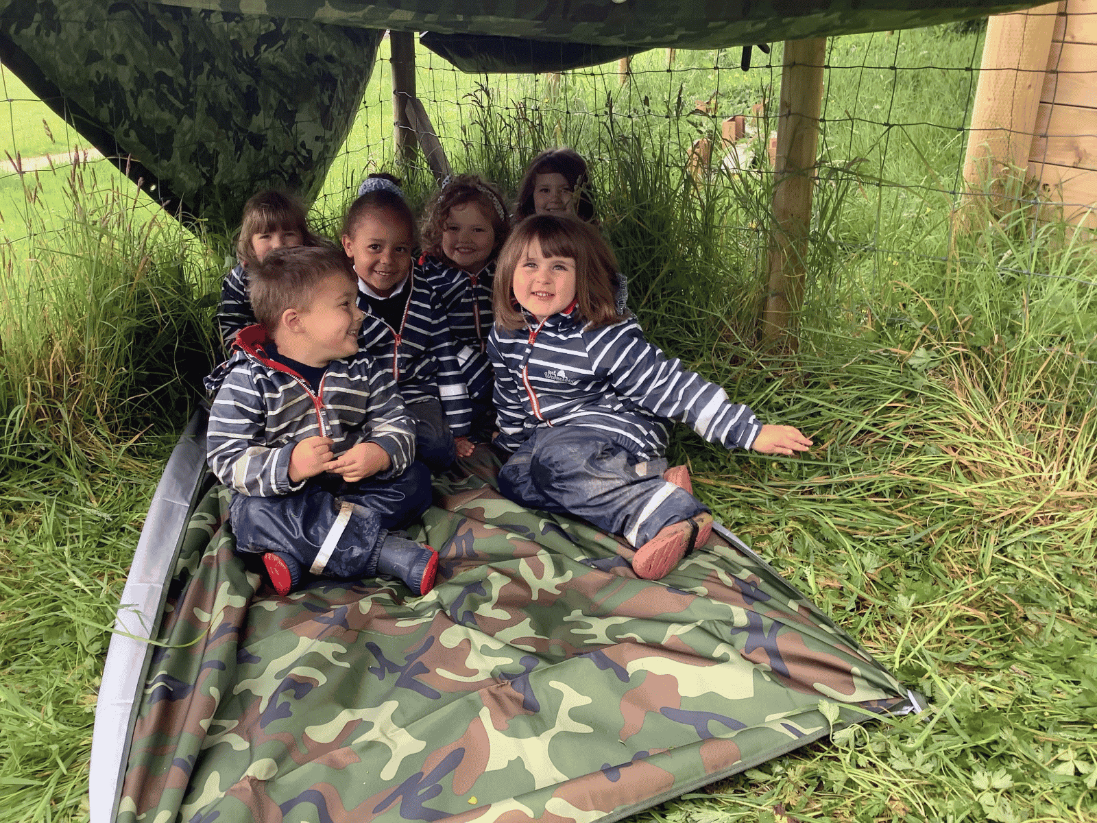 Burrows Nursery children in outdoor den